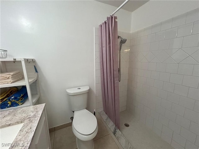 bathroom featuring toilet, tile patterned floors, a shower with curtain, and vanity