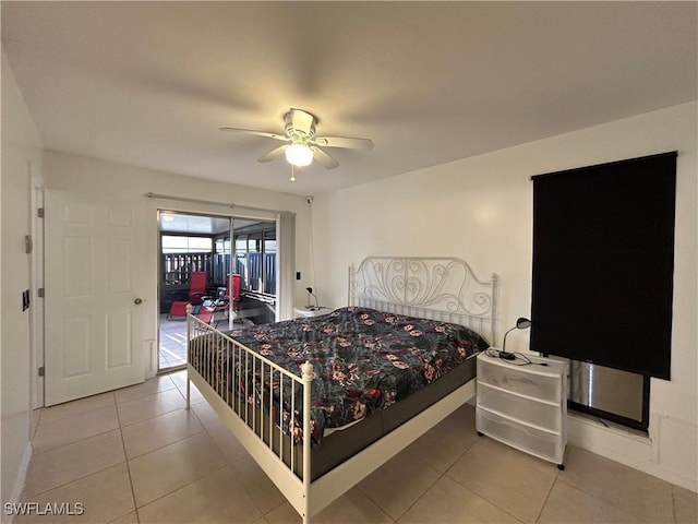 tiled bedroom featuring ceiling fan and access to exterior