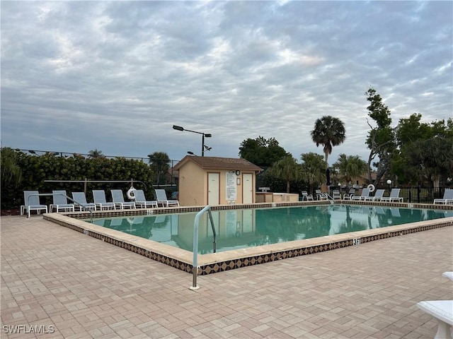 view of swimming pool featuring a patio area