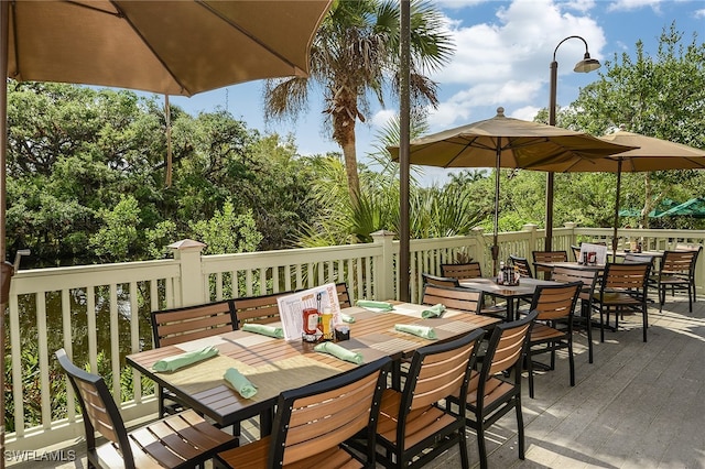 13617 Heritage Preserve Dr, Fort Myers, FL 33905 - wooden terrace with outdoor dining space