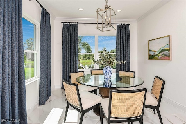 dining room featuring a healthy amount of sunlight, a notable chandelier, and ornamental molding