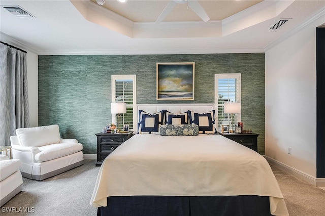 bedroom with carpet flooring, a raised ceiling, ceiling fan, and crown molding