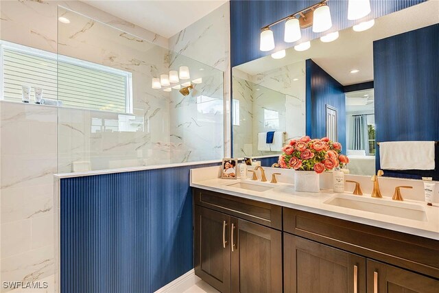 bathroom featuring vanity and a tile shower