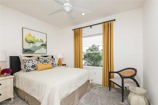 bedroom featuring ceiling fan and light colored carpet