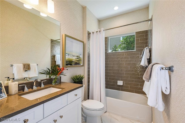 full bathroom featuring vanity, toilet, and shower / tub combo