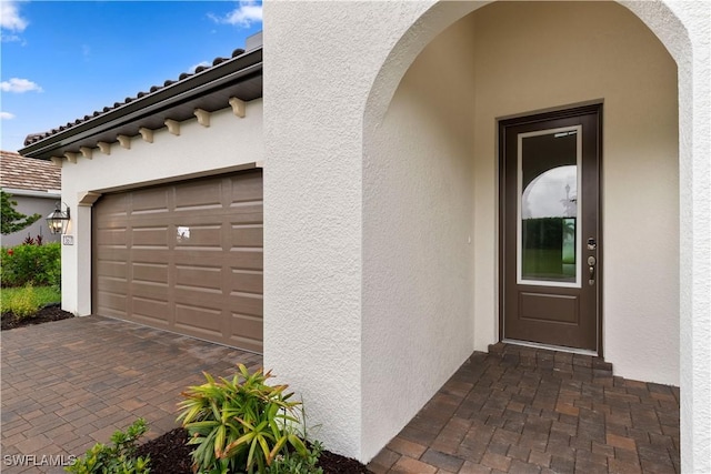 13617 Heritage Preserve Dr, Fort Myers, FL 33905 - property entrance with stucco siding and decorative driveway