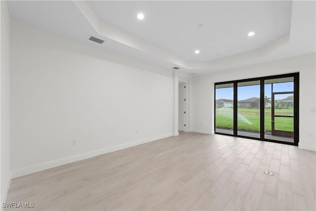 13617 Heritage Preserve Dr, Fort Myers, FL 33905 - spare room with a raised ceiling, light wood-style flooring, baseboards, and recessed lighting