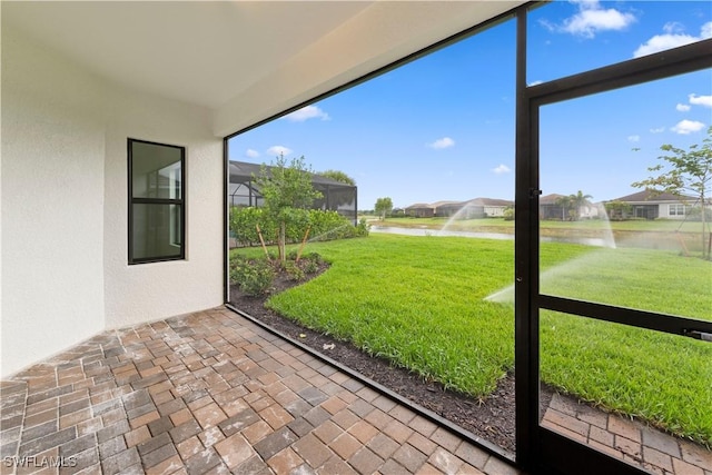 13617 Heritage Preserve Dr, Fort Myers, FL 33905 - unfurnished sunroom with a water view and a residential view