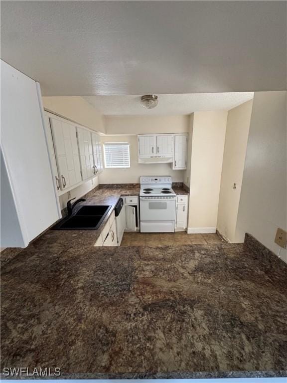 kitchen featuring white cabinets, white appliances, kitchen peninsula, and sink