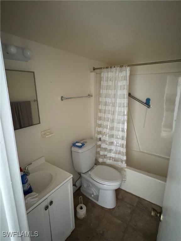 full bathroom featuring shower / tub combo, vanity, and toilet