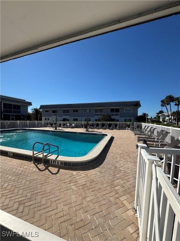 view of pool featuring a patio