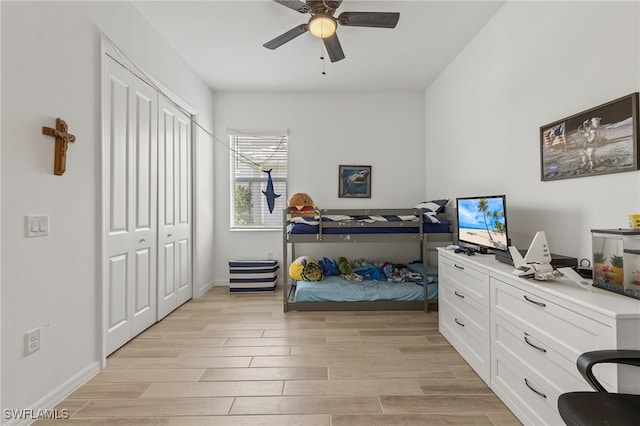 bedroom with light wood-type flooring, a closet, and ceiling fan