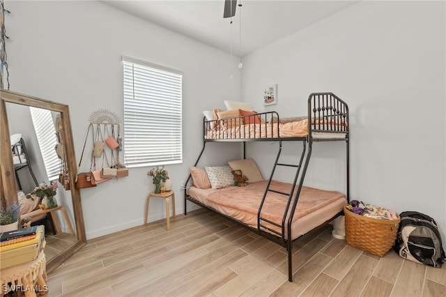 bedroom featuring multiple windows and ceiling fan