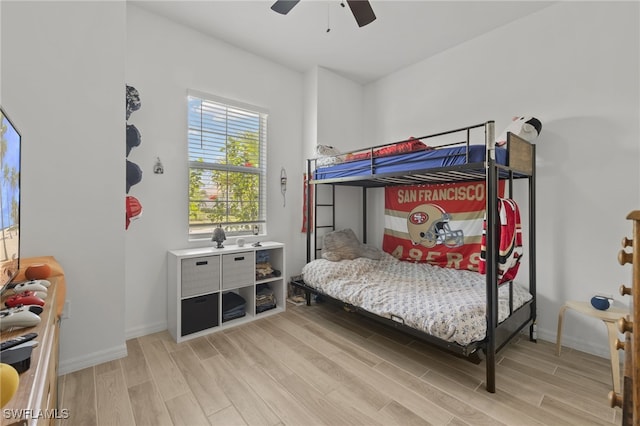 bedroom with ceiling fan and light wood-type flooring