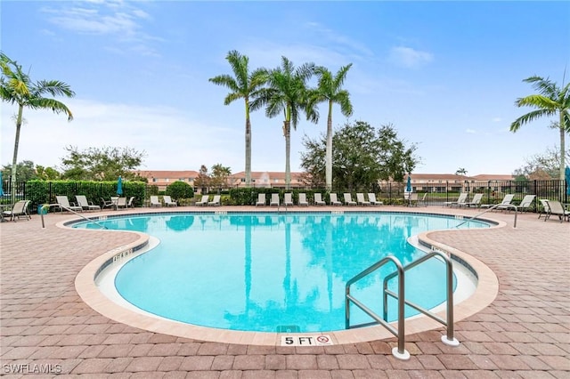 view of swimming pool with a patio area