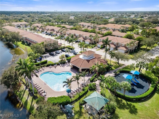 birds eye view of property featuring a water view