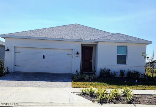 ranch-style house featuring a garage