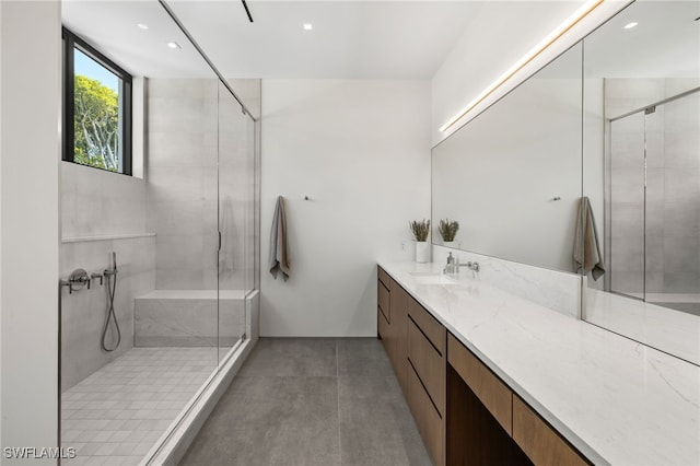 full bathroom with recessed lighting, vanity, and a shower stall