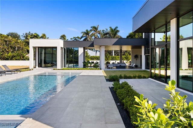 view of swimming pool featuring a patio