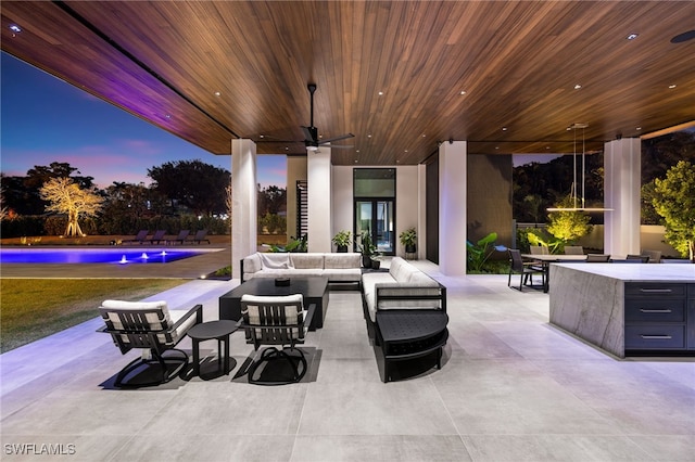 view of patio featuring an outdoor pool, an outdoor hangout area, and ceiling fan