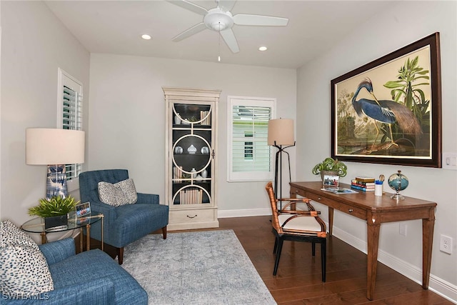 home office featuring ceiling fan and dark hardwood / wood-style floors