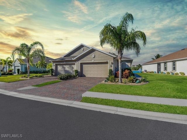 ranch-style home with a lawn