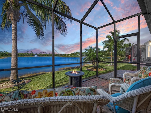 unfurnished sunroom with a water view