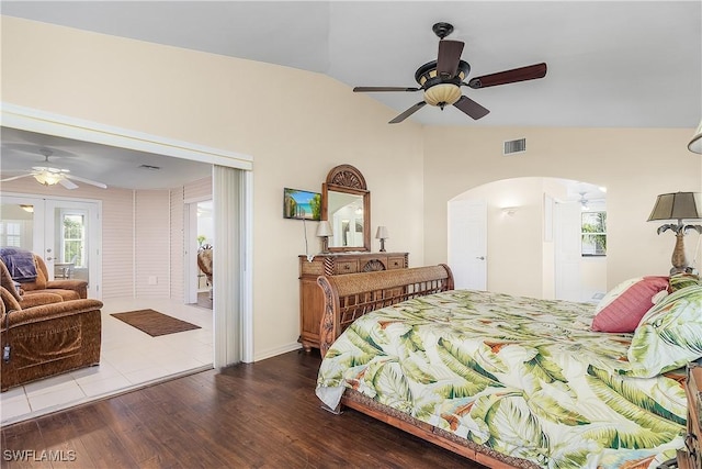 bedroom featuring access to outside, french doors, hardwood / wood-style floors, lofted ceiling, and ceiling fan