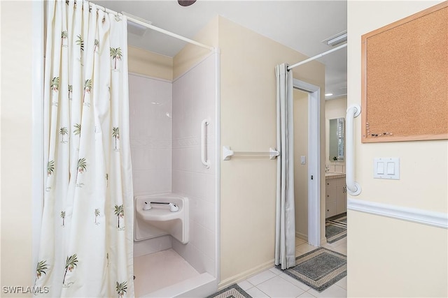 bathroom featuring curtained shower, tile patterned floors, and vanity