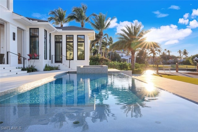 view of swimming pool with a patio area