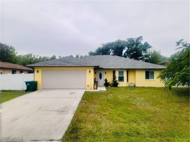 ranch-style house featuring a garage, fence, driveway, stucco siding, and a front yard