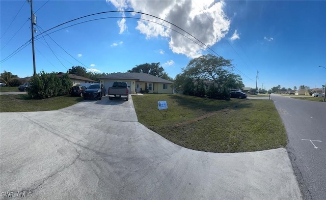 view of front of house with a front yard and driveway