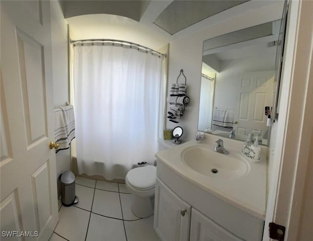 full bathroom featuring toilet, shower / bath combo, vanity, and tile patterned floors