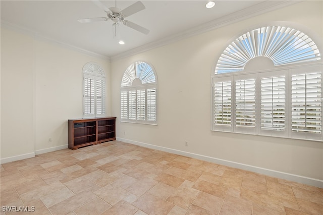 spare room with ceiling fan and ornamental molding