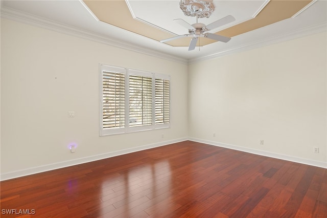 empty room with crown molding, hardwood / wood-style floors, and ceiling fan