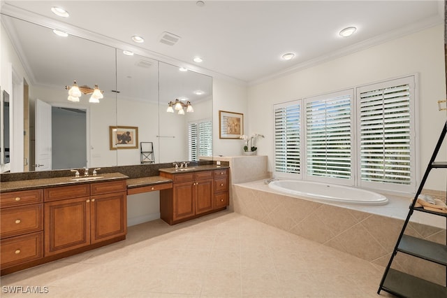 bathroom featuring tile patterned floors, ornamental molding, vanity, and tiled tub