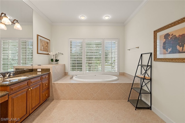 bathroom with tiled tub, ornamental molding, tile patterned floors, and vanity