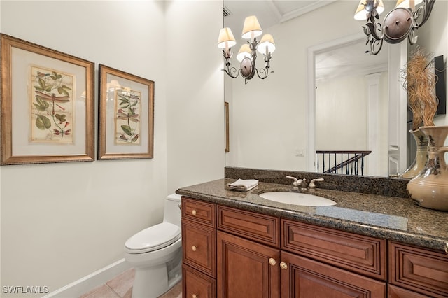 bathroom with tile patterned flooring, vanity, and toilet