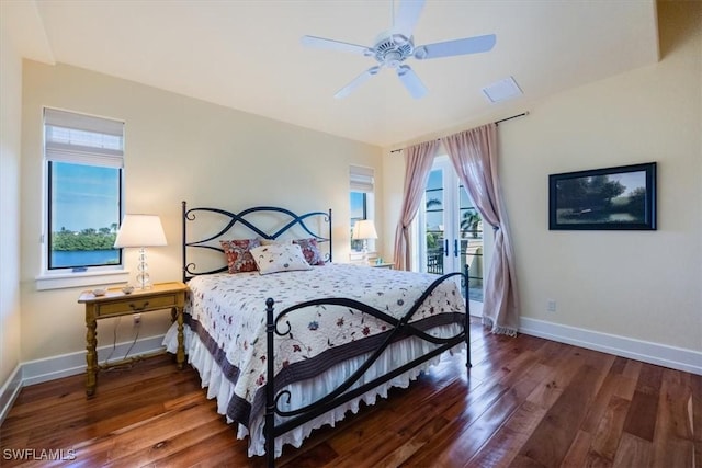 bedroom with ceiling fan and dark wood-type flooring