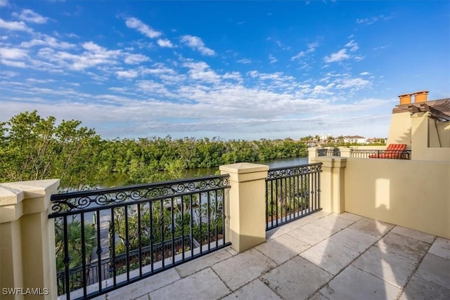 balcony featuring a water view