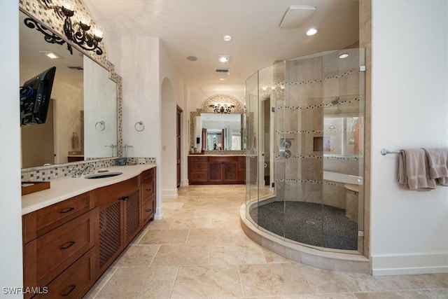 full bathroom with recessed lighting, vanity, a stall shower, baseboards, and stone finish floor