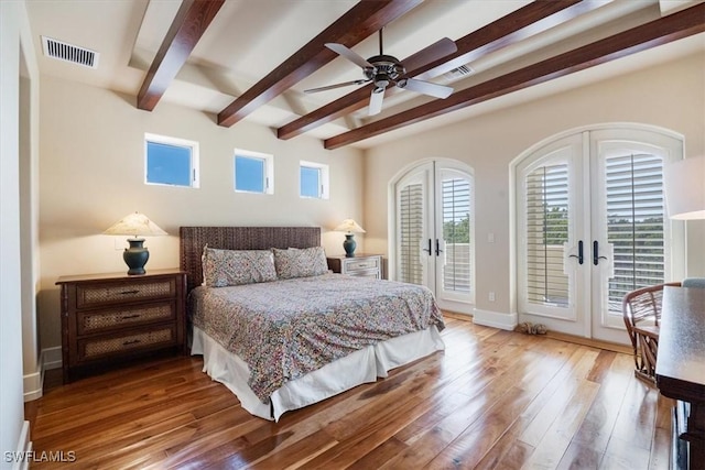 bedroom featuring wood finished floors, visible vents, access to exterior, french doors, and beamed ceiling