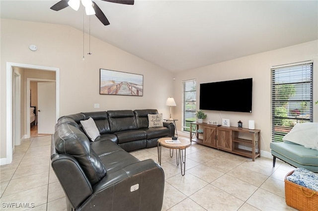 tiled living room with ceiling fan and lofted ceiling