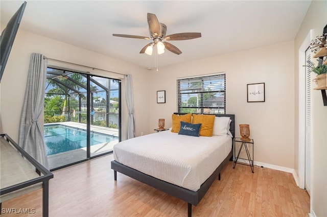 bedroom with multiple windows, wood-type flooring, access to outside, and ceiling fan