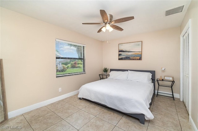 bedroom featuring ceiling fan and light tile patterned floors