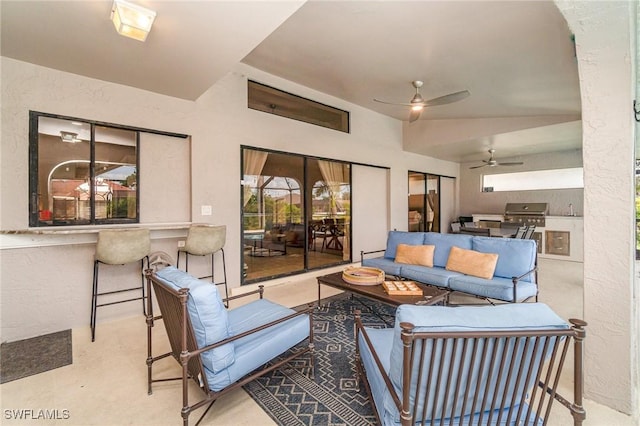 living room featuring vaulted ceiling and ceiling fan