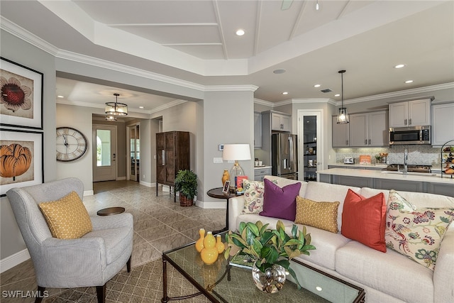 living room featuring crown molding and an inviting chandelier