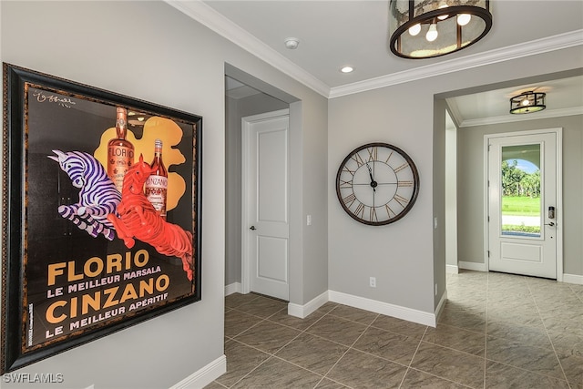 hallway with dark tile patterned flooring and crown molding