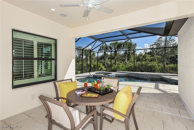 view of patio with glass enclosure, ceiling fan, and a pool with hot tub