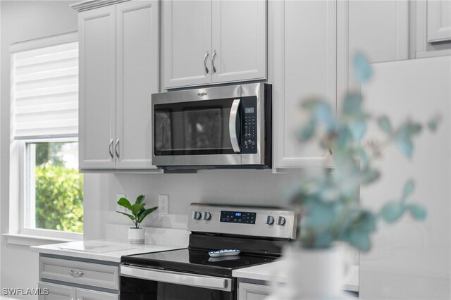 kitchen featuring white cabinetry and stainless steel appliances